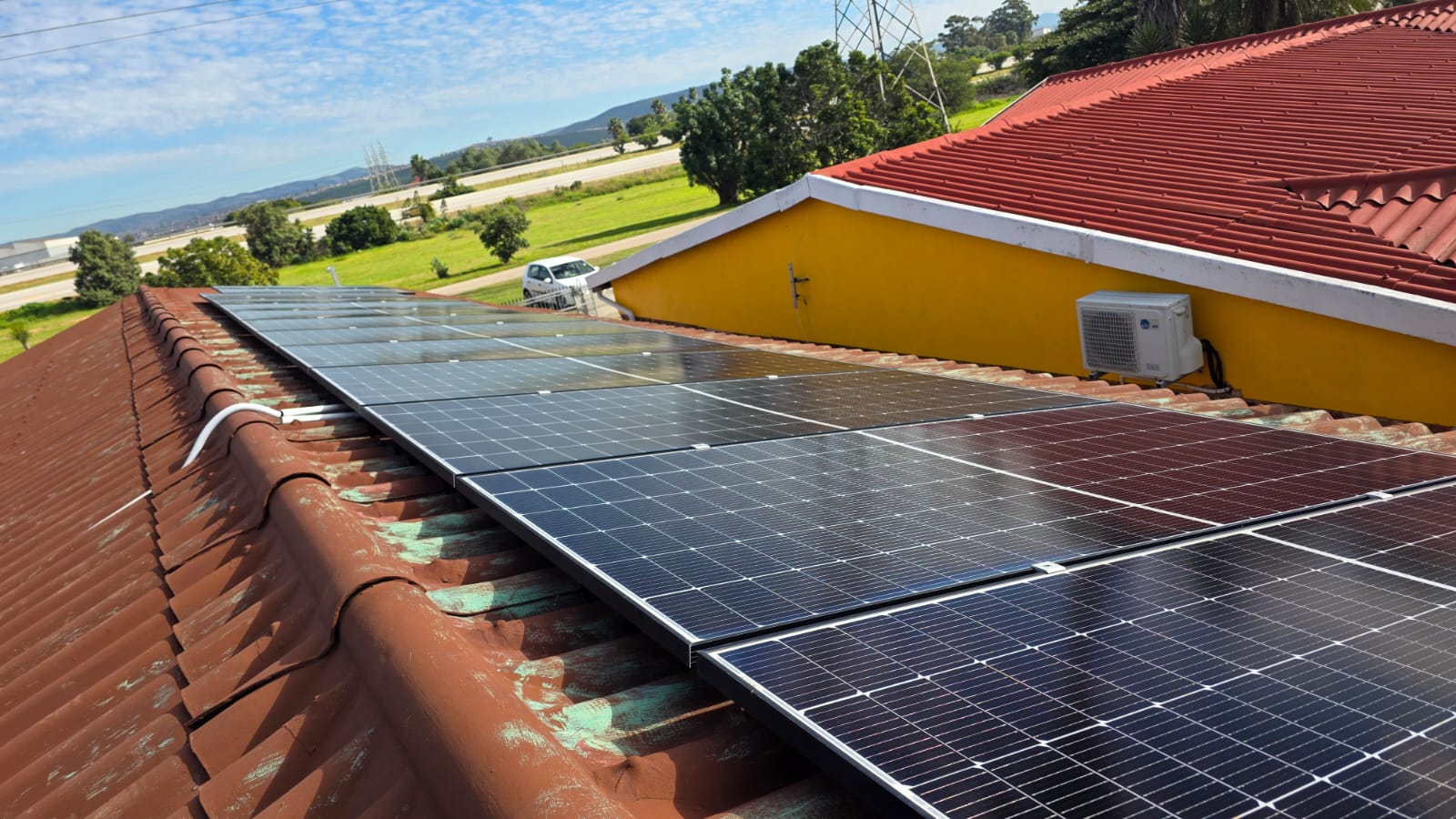 Sun Clean Solutions technician cleaning solar panels with a soft-bristle brush